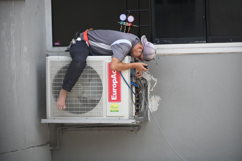 Friendly HVAC technician providing service